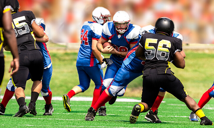 College students playing football