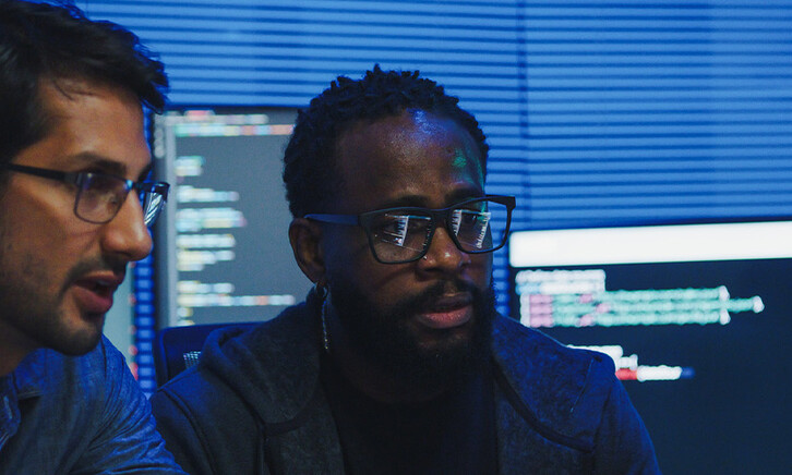 Co-workers reviewing code