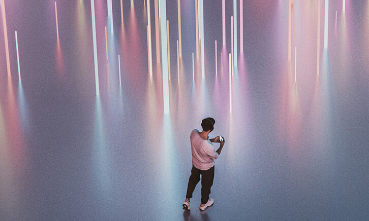 Person walking with phone and headphones