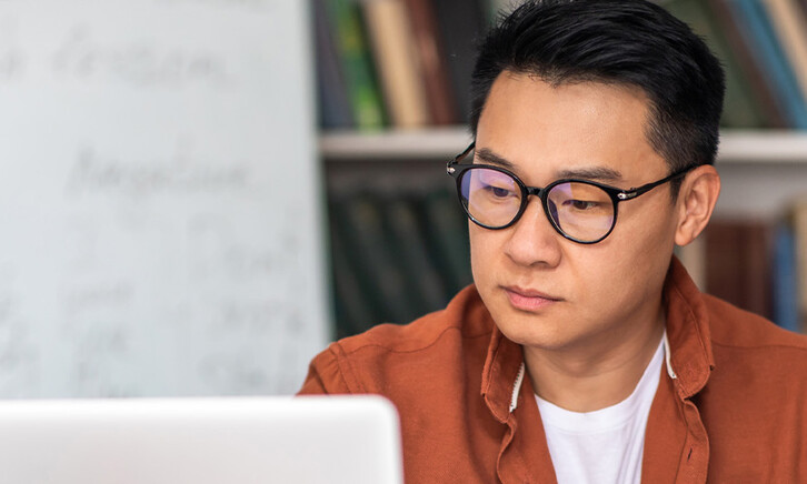 Student taking notes