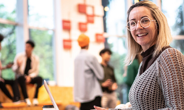 Person working on computer on campus