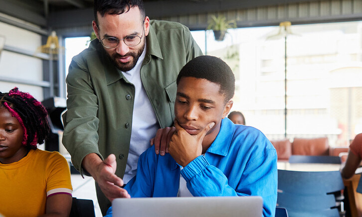 Professor helping students