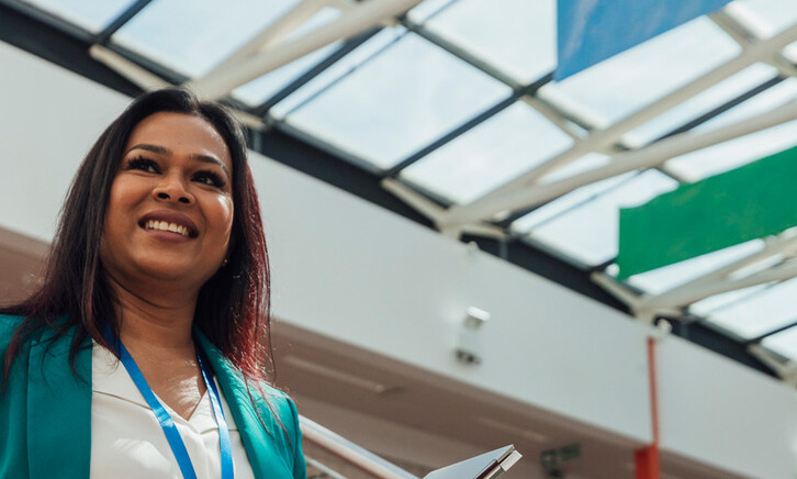 Principal smiling in the hallway of her school