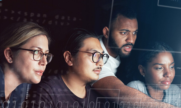 People working on computer together 