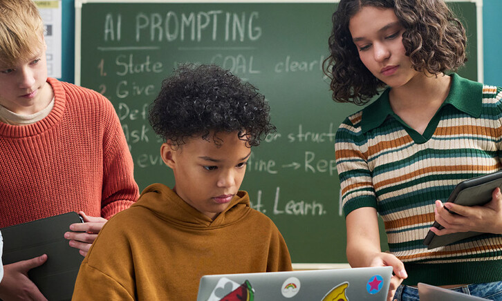 Students using computer in class