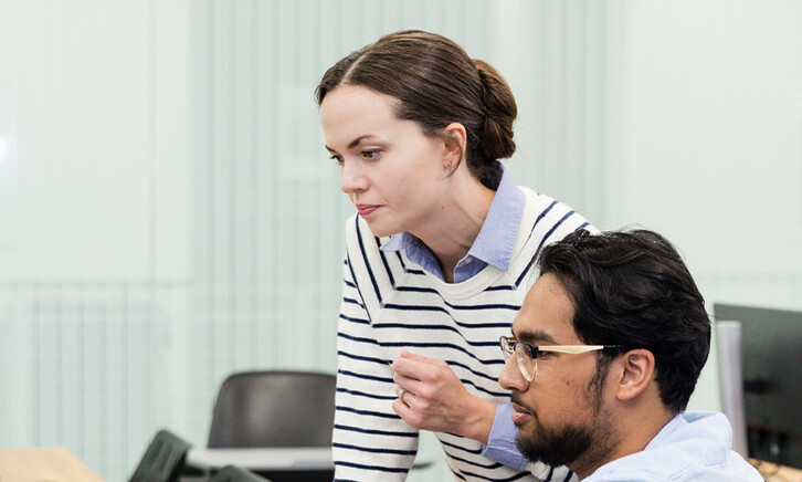 IT team looking at computer