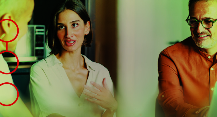 Three people engaged in a conversation