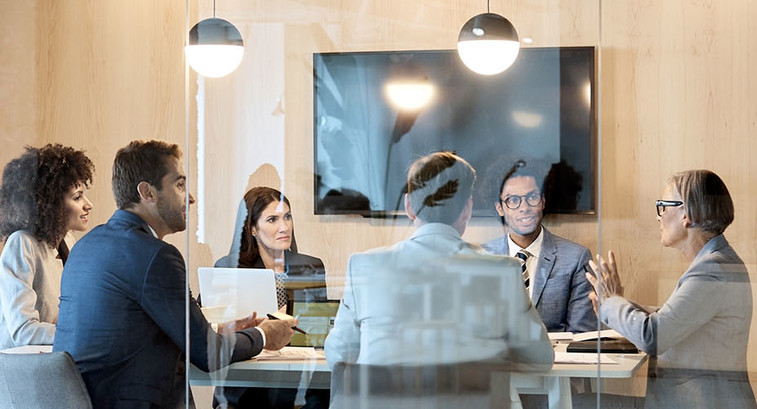 People meeting formally in a boardroom