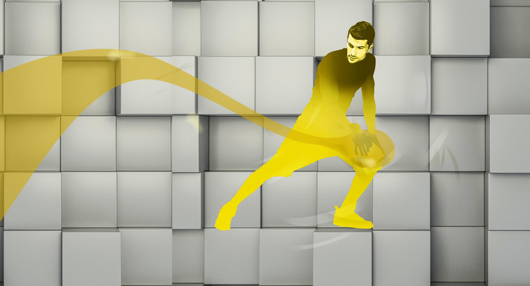A man spreads yellow oil over a gray background