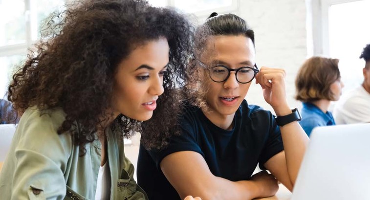 College students working together in class