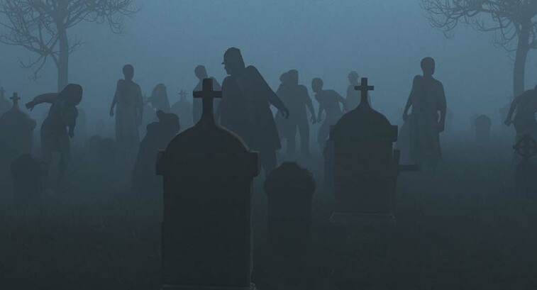 Silhouetted zombies rise from a foggy graveyard