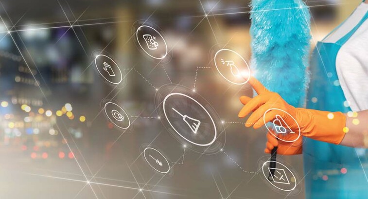 A woman holding a feather duster is superimposed behind a tranparent touch screen display
