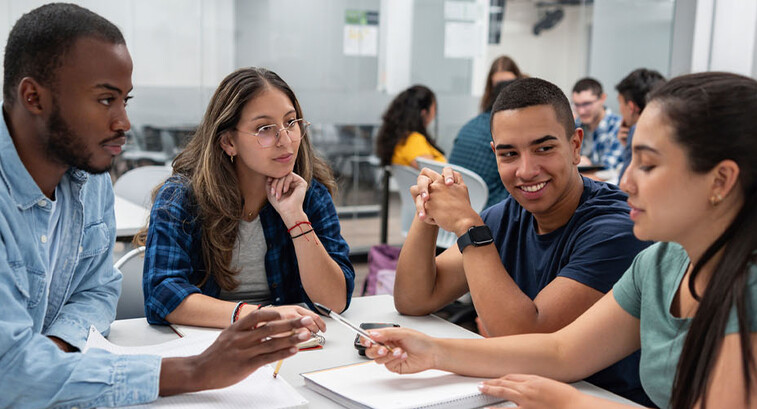 Group of students studying together in the classroom