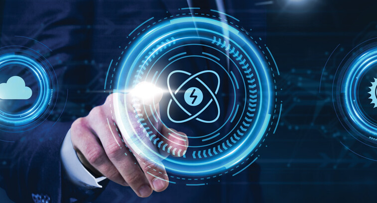 Person pressing illustrated atom