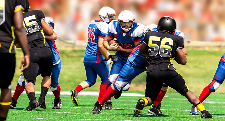 College students playing football