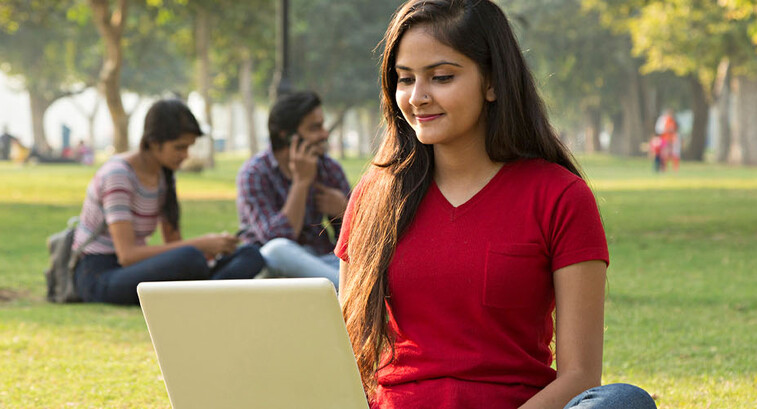 Student using laptop outside
