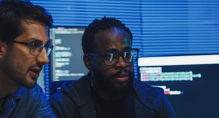 Co-workers reviewing code