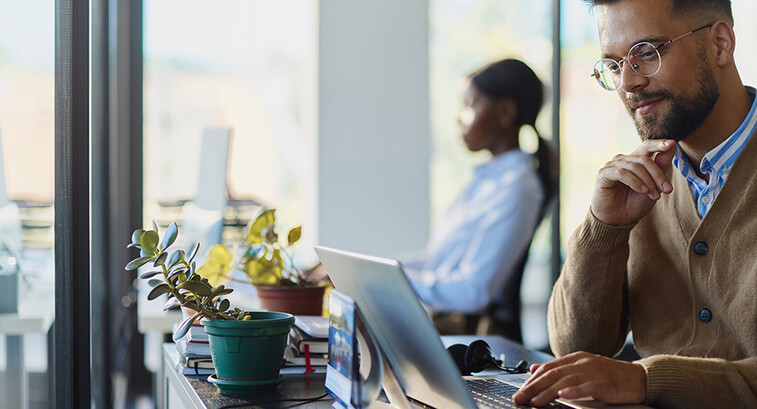 Man working on a computer in an office