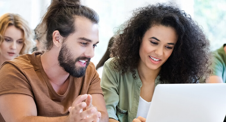 Students collaborating with tech