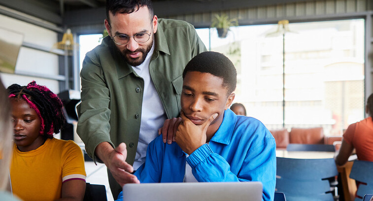 Professor helping students