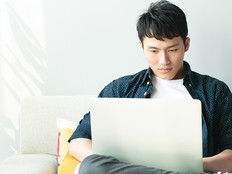 college student using laptop at home