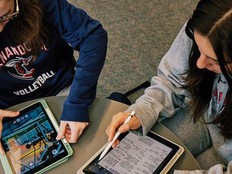 Shenandoah University students use technology at a table