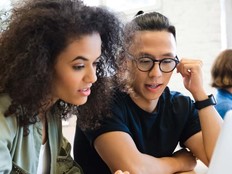 College students working together in class