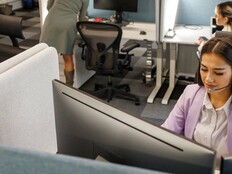 IT workers at their desks in an office