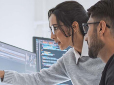 Coworkers reviewing code
