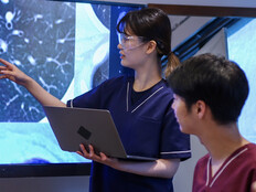 Health care professionals looking at medical x-rays