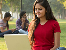 Student using laptop outside