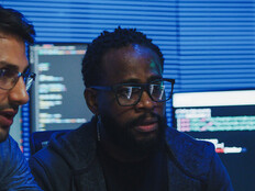 Co-workers reviewing code