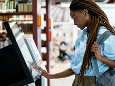 Student searching for a book in the library system