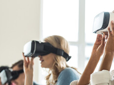 College students wearing VR headsets