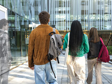 Group of students. One having transparent, ghost-like appearance.