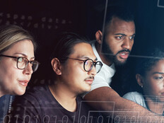 People working on computer together 