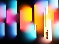 Illustration of person surrounded by multicolor spotlight 