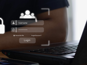 Person using MFA to access laptop