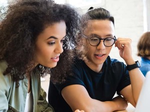 College students working together in class