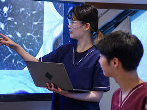 Health care professionals looking at medical x-rays