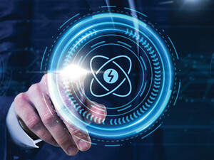 Person pressing illustrated atom