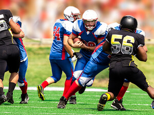 College students playing football