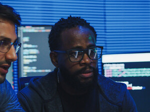 Co-workers reviewing code