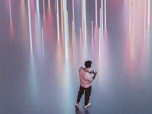 Person walking with phone and headphones