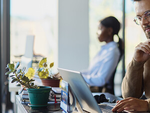 Man working on a computer in an office