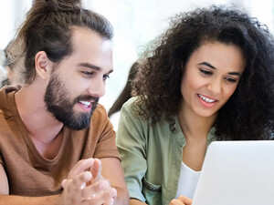 Students collaborating with tech