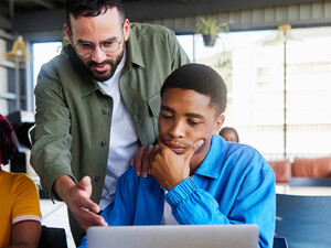 Professor helping students