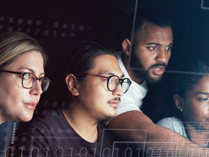 People working on computer together 