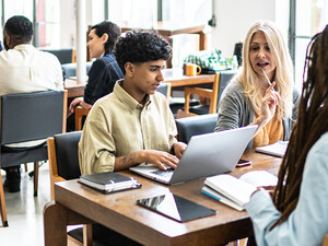 Students working at tables together