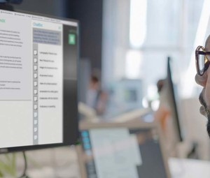 A man looks at a generative AI platform on a computer screen